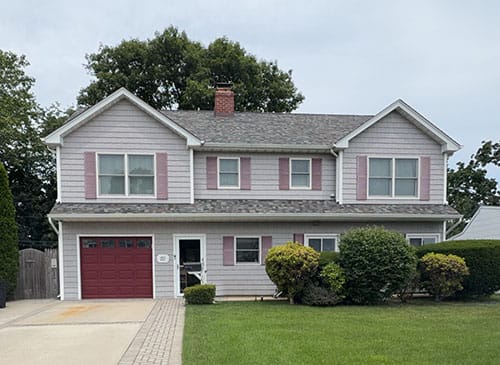 Two-story expanded cape style home in Nassau County, subject of a sample inspection report
