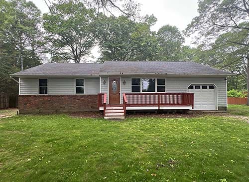 Two-story expanded cape style home in Nassau County, subject of a sample inspection report