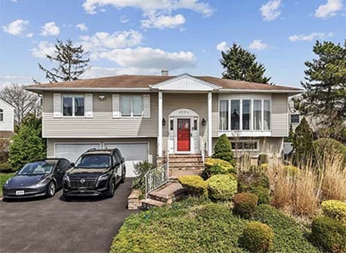 Two-story expanded cape style home in Nassau County, subject of a sample inspection report